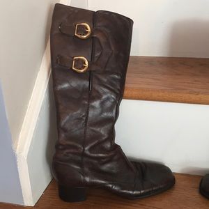 Vintage Brown leather boots with gold buckles.